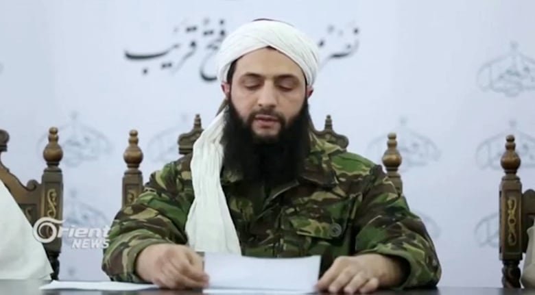 Then-Syrian Islamist rebel group Nusra Front leader Abu Mohammed al-Golani speaks at an unknown location in this still image from 2016 file video obtained December 5, 2024. 