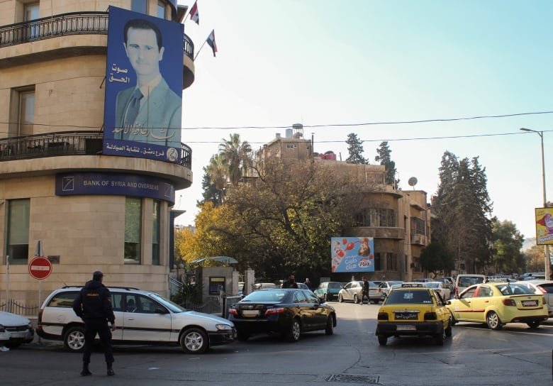 A poster depicting Syria's President Bashar al-Assad is placed on a building in Damascus, after last week's rebel seizure of Aleppo marked the biggest offensive for years, Syria December 5, 2024. 