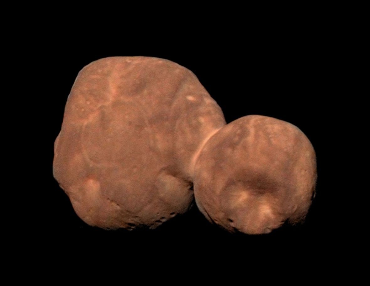 Against a black backdrop of space, we see a double-lobed potato-looking celestial body. 