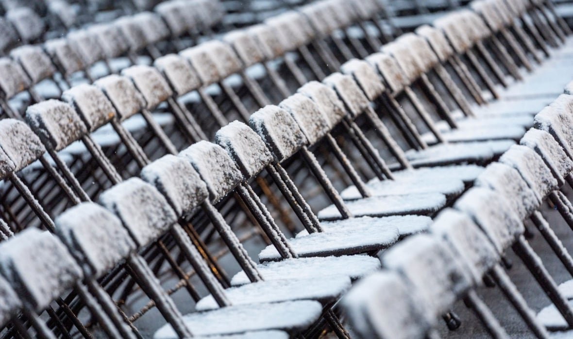 snow-covered folding chairs 